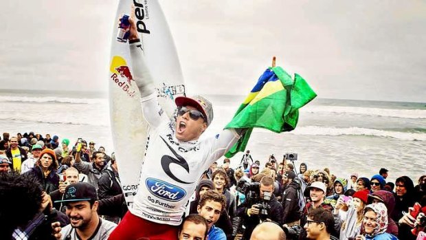 Bells' bell is rung ... Adriano De Souza is chaired up the beach.