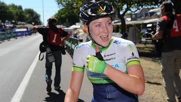 Winning smile: Gracie Elvin overcame injuries and being dropped on the last lap to defend her Australian road race title.