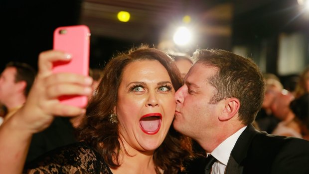 Selfie time: Karl Stefanovic kisses Chrissie Swan as she takes a selfie at the Logie Awards.
