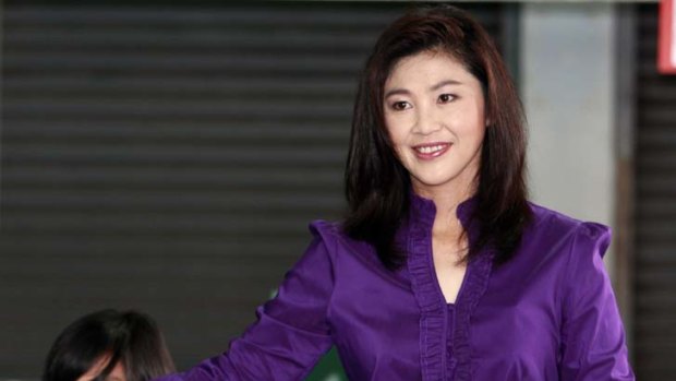 Reason to smile ... Thailand's likely first female leader, Yingluck Shinawatra, casts her vote.
