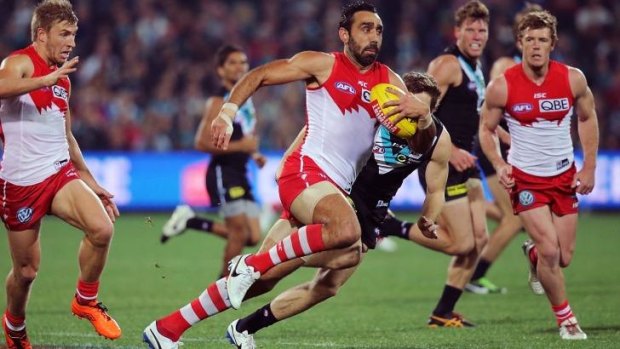 Adam Goodes runs with the ball against Port Adelaide Power in round 20.