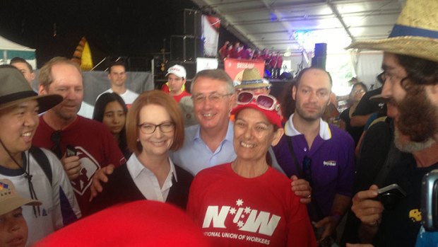Prime Minister Julia Gillard, her deputy Wayne Swan by her side, told the crowd that that standing that standing for the working people of Queensland meant standing against the state government cuts.