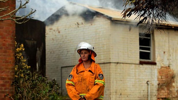 Facing the flames: Laura Tallon, 22, of the Dora Creek RFS, works in administration by day and has spent more than 80 hours fighting fires in the past week.