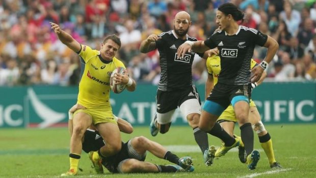 Australia's Alex Gibbon is tackled during the Cup semi-final loss to New Zealand.