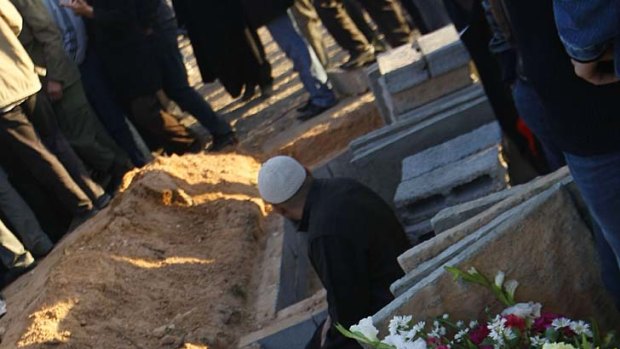 Reporters were shown graves dug for those killed in coalition attacks.