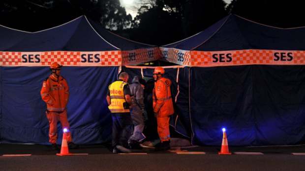 Tragedy ... Emergency workers at the scene of the stabbing in Mount Waverley.