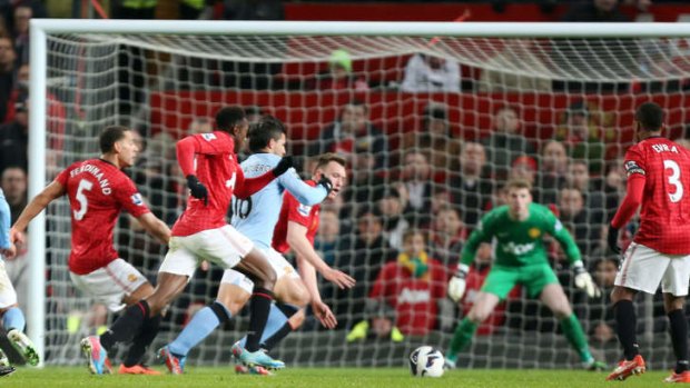 Winner: Manchester United players fail to stop Sergio Aguero from breaking through to score.