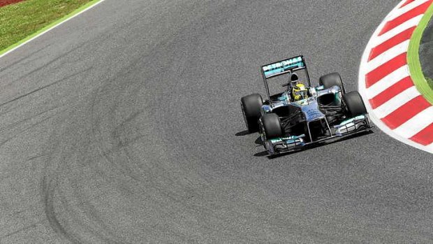Tyre concerns: Nico Rosberg drives during the qualifying session at the Circuit de Catalunya .