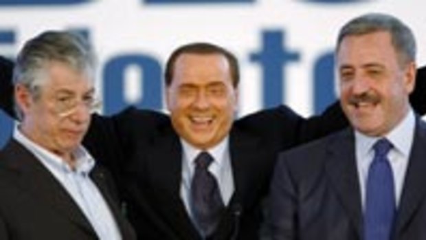 Rumpus ... Mr Berlusconi, centre, is clashing with Mr Murdoch.