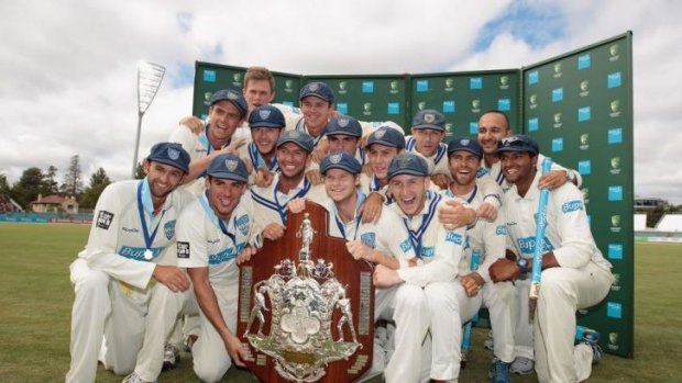 Winning smiles: NSW players celebrate their resounding Sheffield Shield success.