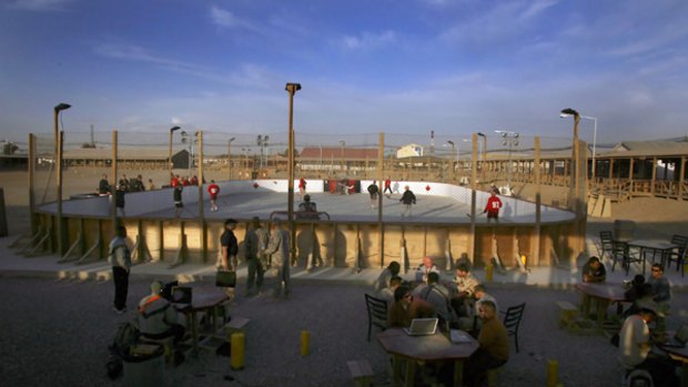 Canadian soldiers play hockey on a concrete  rink during a moment of down time at Kandahar Air Field, Afghanistan. Kandahar is one of the two biggest military bases in Afghanistan with about 20,000 troops.