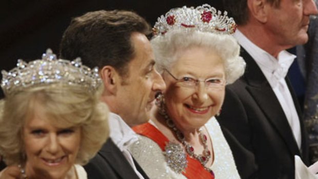 Gin-fuelled small talk ... the Duchess of Cornwall, Nicolas Sarkozy and the Queen at the state banquet in 2008.