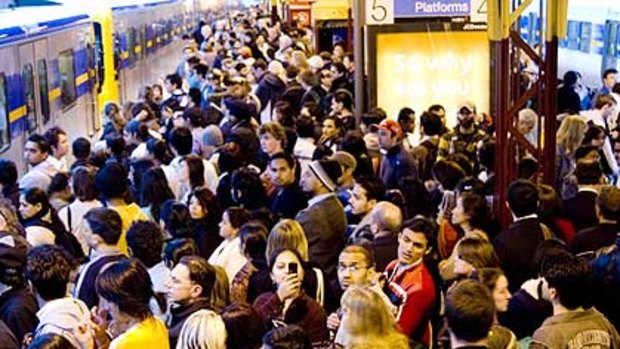 Peak hour commuters cram onto the platforms at Flinders Street station.