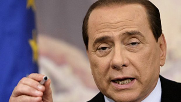 Right of refusal... Italian Prime Minister Silvio Berlusconi defends the crackdown.