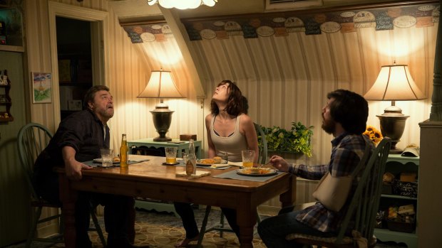 John Goodman as Howard; Mary Elizabeth Winstead as Michelle; and John Gallagher Jnr as Emmett in 