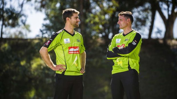 Ryan Carters and Mike Hussey, from the Sydney Thunder, at the University of Canberra following the announcement of a sponsorship deal between the UC and Thunder.