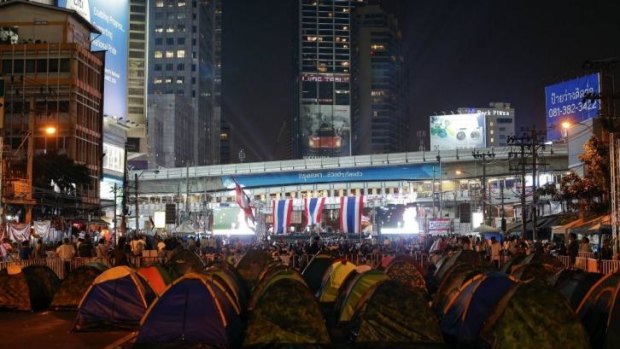 Protesters camp out to occupy a main intersection in central Bangkok.