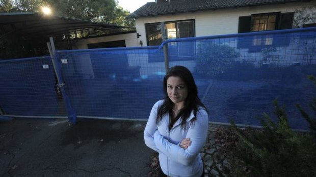 Downer resident Emily Scott lives across the road from this property in Bradfield Street which is due to be demolished because of the asbestos it contains.