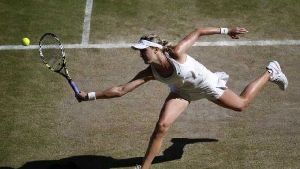 Canada's Eugenie Bouchard returns a backhand to Romania's Simona Halep.