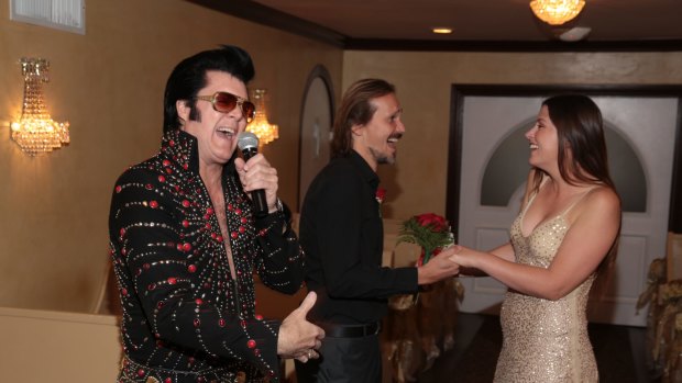 The author Shaney Hudson and hubby renew their vows to the sounds of Elvis.