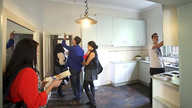House hunters: Interested buyers inspect a Marrickville property ahead of auction. The house sold for $890,000.