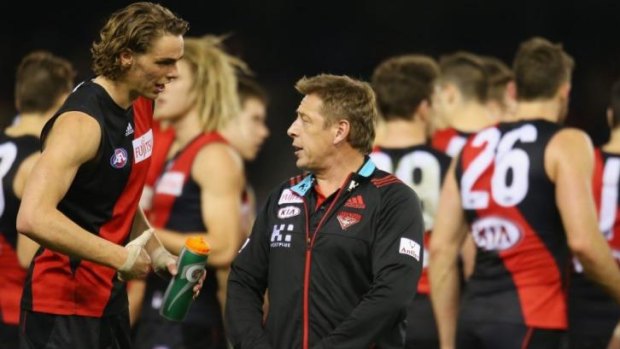 Mark Thompson has a word with Joe Daniher during a break in the game on Saturday night.