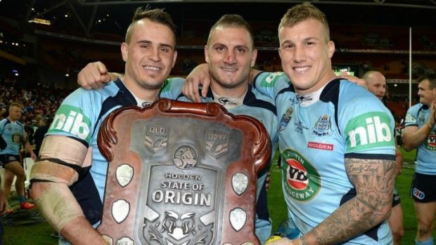 Josh Reynolds, Robbie Farah and Trent Hodkinson with the State of Origin shield.