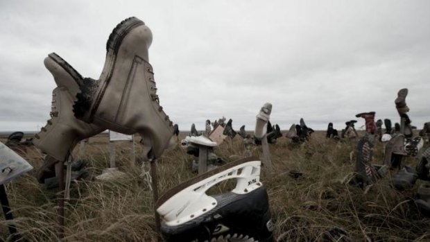 View of boots at the so-called 'Boot hill' --where tourists and locals leave a shoe before leaving the island, according to tradition-- near Stanley, in the Falkland Islands, on March 26, 2012. 
