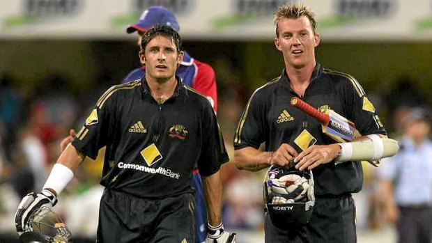 Good mates: Mike Hussey and Brett Lee leave the field after victory over England in 2007.