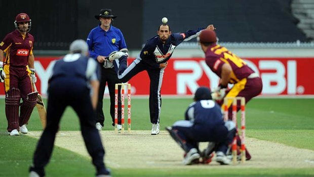 Come in spinner: Victoria's Fawad Ahmed bowls in the Bushrangers' loss to the Queensland Bulls.
