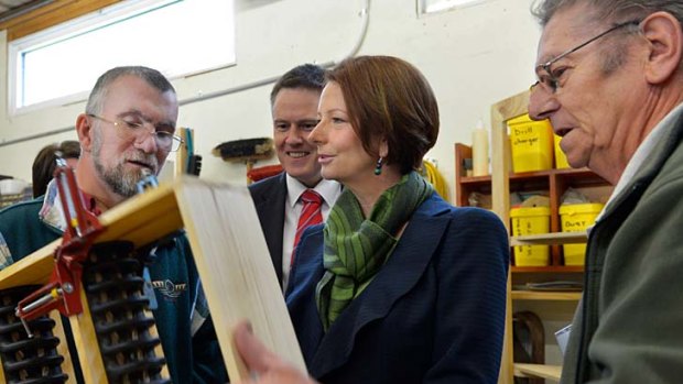 Prime Minister Julia Gillard visits a Men's Shed. 'First Bloke' Tim Mathieson is patron of the movement.