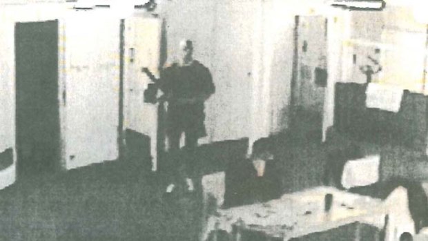A still photograph taken from CCTV footage moments before Carl Williams was killed. The picture shows Matthew Johnson approaching Carl Williams from behind in the prison unit they shared.