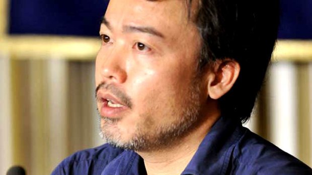 Japanese freelance journalist Kosuke Tsuneoka speaks to the press in Tokyo.
