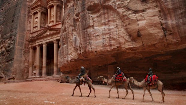 Camel riders in Petra, Jordan.