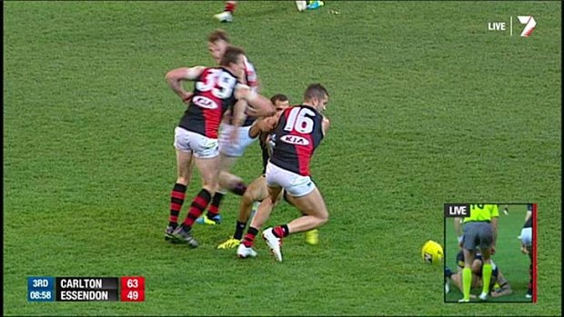 Heath Hocking makes contact with Chris Yarran.