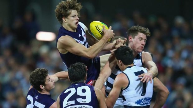 Flying star: Docker Nat Fyfe grabs a high mark during Geelong’s two-point victory at Simonds Stadium on Saturday night. 