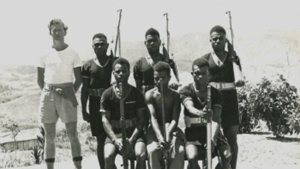 John Stuntz with Otibanda detachment, 1950,
seated Cpl Boigara on left, Lance Cpl Kupruwann
on the right. 