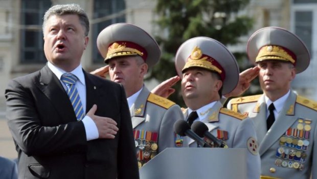 Ukrainian President Petro Poroshenko and the supreme command staff sing the national anthem during celebrations for Ukrainian Independence Day.