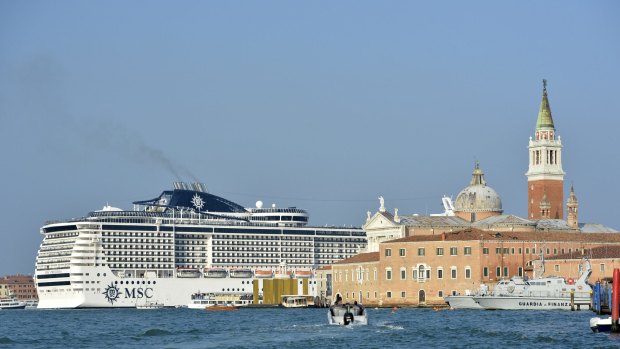 A cruise ship heads into Venice.