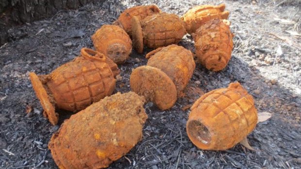 The heavily corroded grenades were found following a large bushfire in the Ravenshoe area.