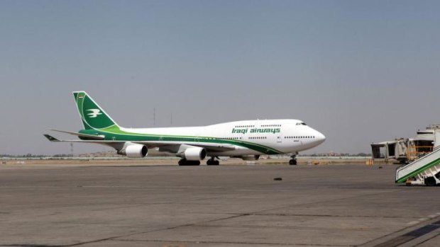 An Iraqi Airways Boeing 747 sits at Baghdad International Airport on Tuesday. The FAA has banned US airlines from flying over Iraq.