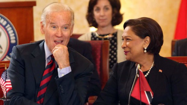 You don't say: US Vice President Joe Biden listens to his host, Trinidad & Tobago's Prime Minister Kamla Persad-Bissessar on Tuesday.