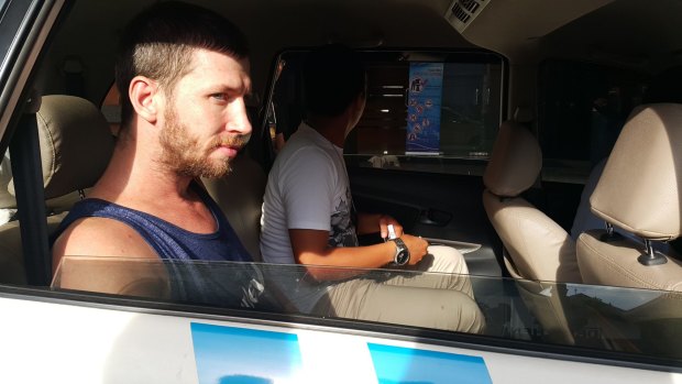 Shaun Davidson waiting to be transferred to Kerobokan jail in Bali after being charged with possessing another person's identity and overstaying his visa in April last year.