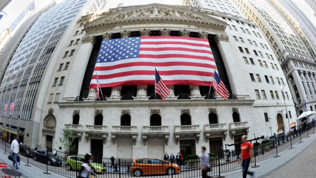 A large American flag draped across the front of the New York Stock Exchange earlier this year.