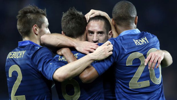 Plenty to celebrate: France's Franck Ribery and his teammates after scoring.