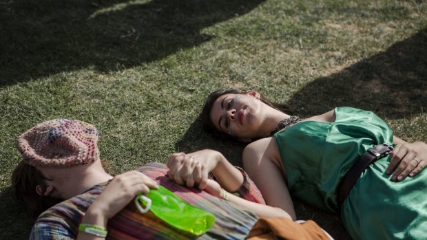 Felix Wishard,16, of Wollongong, and Waihanea Kelly, 17, of Byron Bay,chill out at Groovin the Moo. 