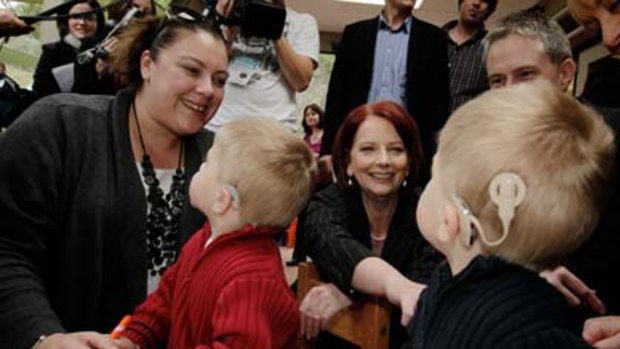 PM jokes with Ben and Lochie Baulch at the Taralye Kindergarten for Deaf Children in Blackburn, Melbourne this morning.