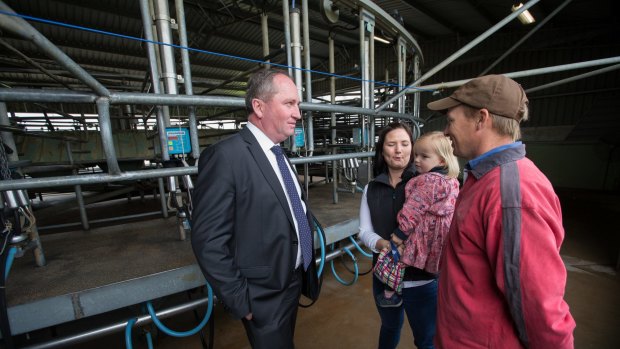 Deputy Prime Minister and Nationals Leader Barnaby Joyce meets with dairy farmer Ashley and Lucy Galt, with 3 year old Alice last week.