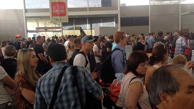Delays ... Overcrowding at Sydney Airport renders announcements inaudible.