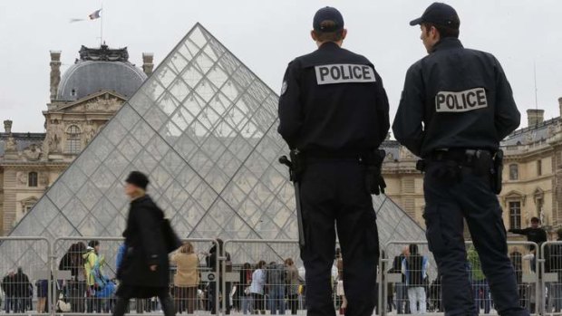 French police patrol next to the Pyramid at the Louvre museum a day after its one-day closure as guards protested that pickpockets were rampant at the world's most visited museum.